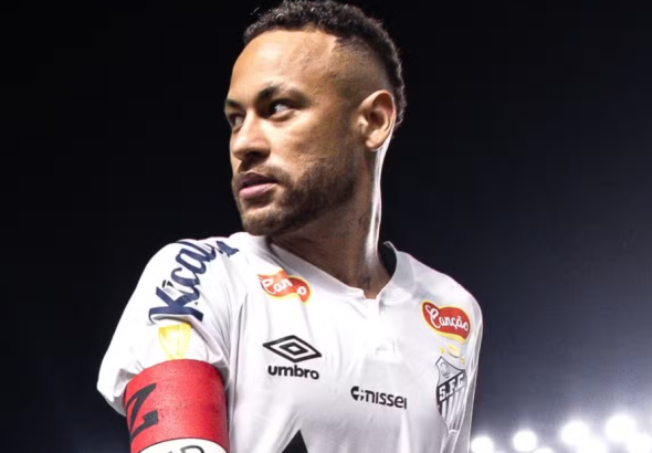 Neymar Jr celebrating a goal in his Santos FC jersey in 2026.